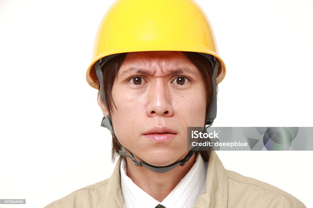 angry construction worker portrait of young Japanese construction worker on white background 2015 Stock Photo