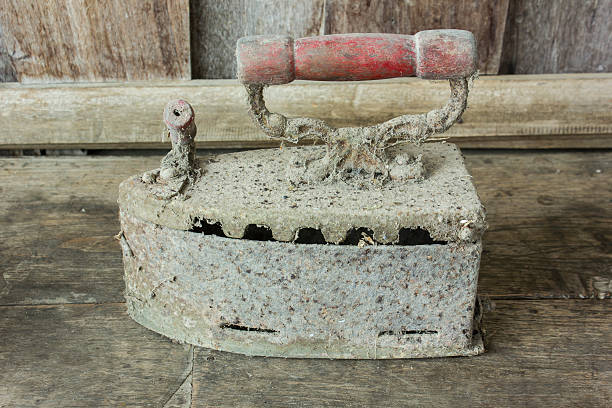 istock Old iron on wooden background 473373586