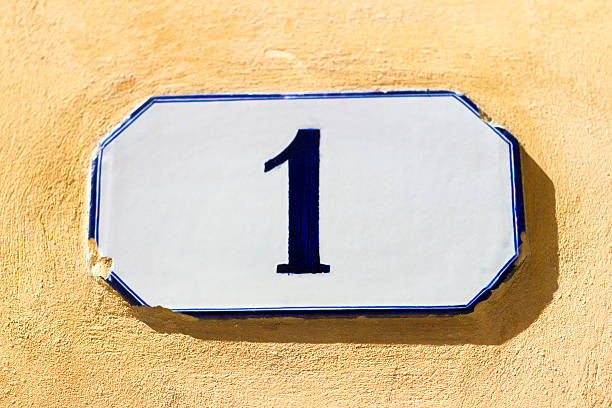 istock Ceramic Address Plaque Number 1 On Yellow Wall 473375618