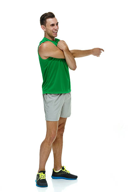 istock Smiling male athlete stretching 473376088