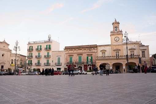 Fasano, Italy - May 2, 2015: Ciaia square in Fasano (Apulia) and the clock tower at sunset