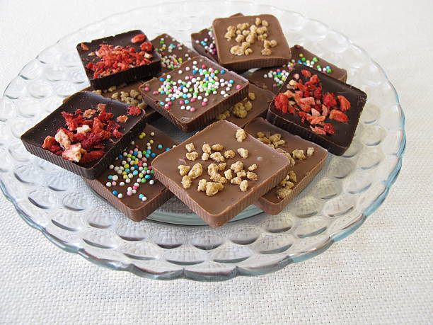 istock Various homemade chocolate bars on glass plate 473420894