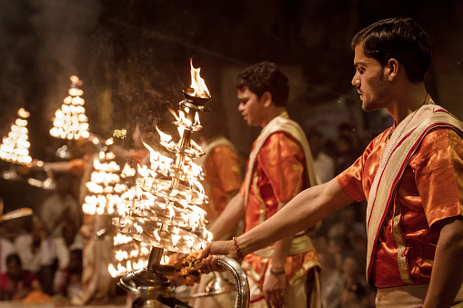 Varanasi, India - March 20, 2013: Unidentified young novices on Ganga Aarti ceremony in Varanasi, India