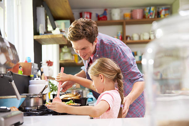 istock A father and daughter cooking together 473423652