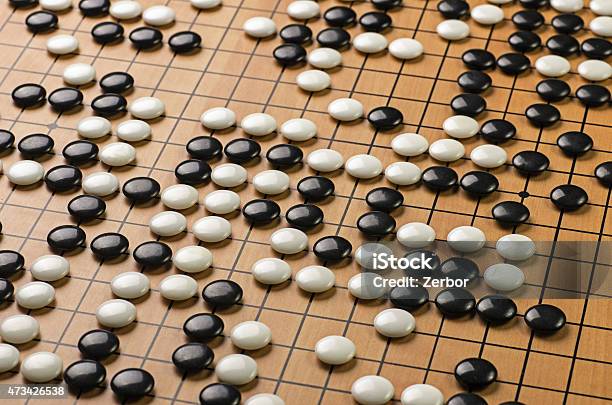 Stones On A Go Board Stock Photo - Download Image Now - Go - Board Game, Board Game, Strategy