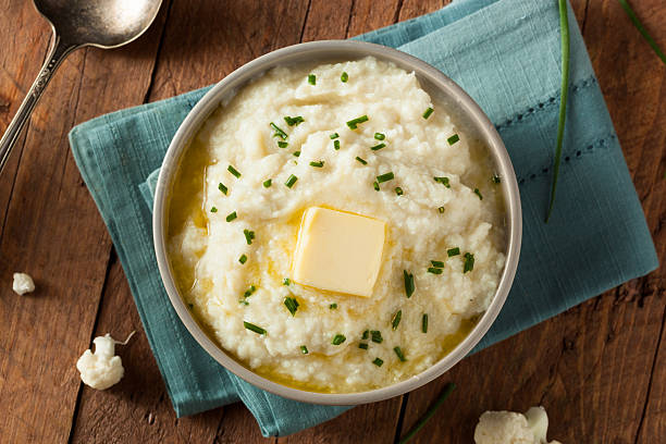 Homemade Organic Mashed Cauliflower Homemade Organic Mashed Cauliflower with Butter and Chives mashed potatoes stock pictures, royalty-free photos & images