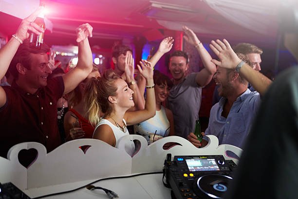 istock People Dancing In Nightclub With DJ In Foreground 473428658