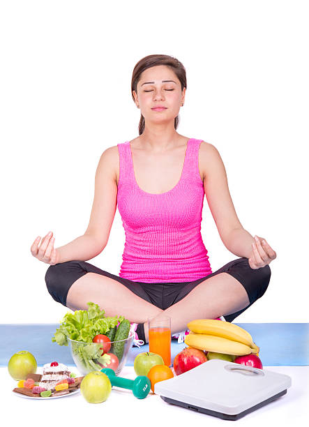 istock girl sitting on the carpet and meditating 473428714