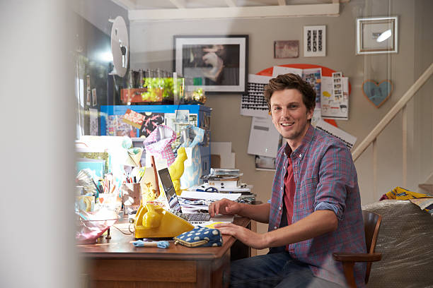 istock A man at a desk in a basement that works from home 473429198