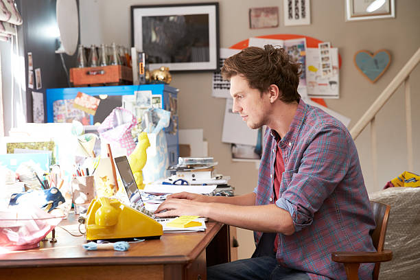 Man On Laptop Running Business From Home Office