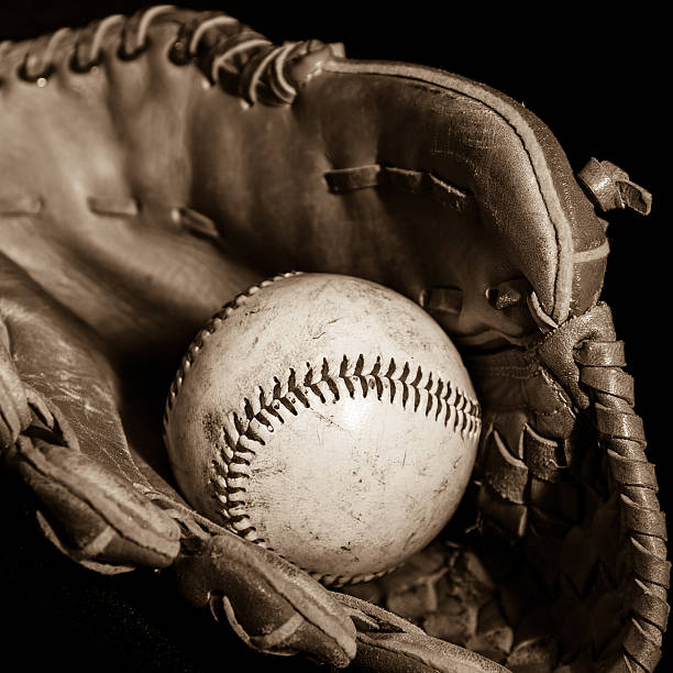 istock Baseball Glove and Ball in Sepia 473432484