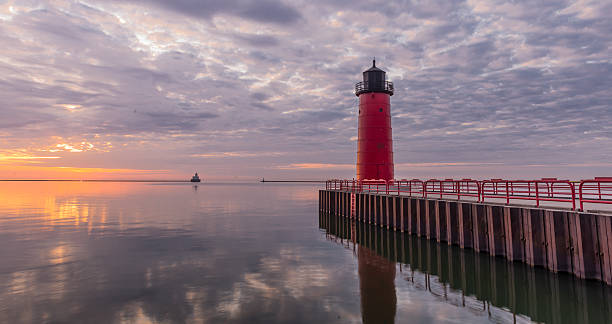 istock Red lighthouse on Lake Michigan at Sunrise 473432668