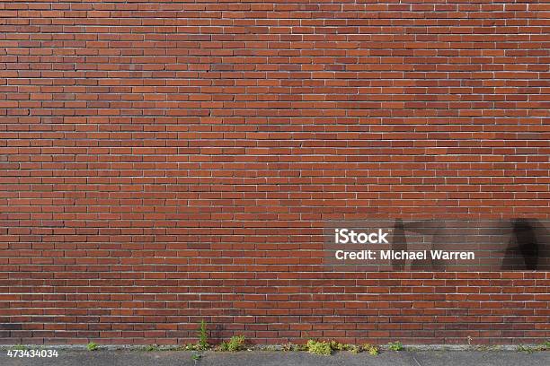 Old Brick Wall Background With Sidewalk Stock Photo - Download Image Now - Brick Wall, Surrounding Wall, Street