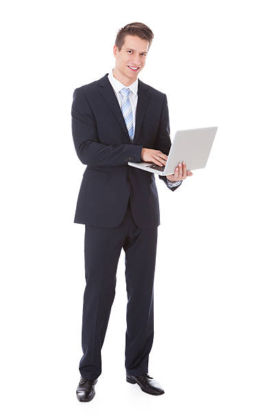 istock Young Businessman Holding Laptop 473435116