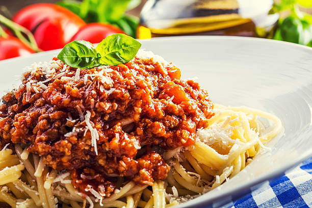 istock Spaghetti bolognese with cherry tomato and basil. 473436160