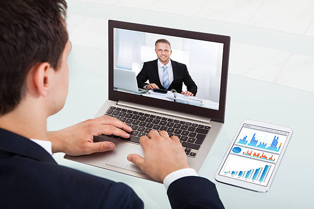 istock Businessman Video Conferencing On Laptop In Office 473437304