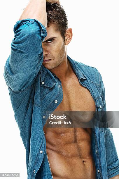 Muscular Man Looking At Camera Stock Photo - Download Image Now - 20-29 Years, 2015, Abdominal Muscle
