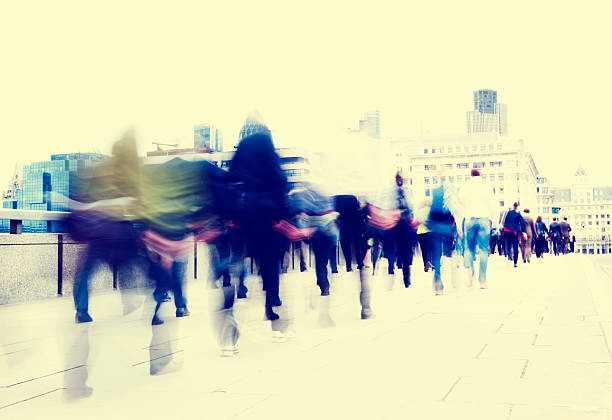 istock People walking on a busy street all blurred out 473442594