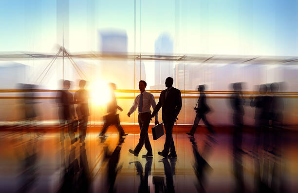 istock Blurred image of business people in an office enviroment 473442614