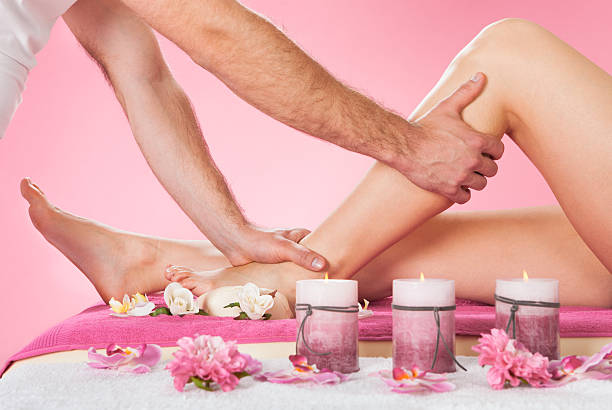 istock Therapist Massaging Customer's Leg At Beauty Spa 473443292