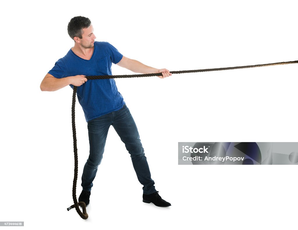Portrait Of A Man Pulling Rope Portrait Of A Man Pulling Rope Over White Background Pulling Stock Photo