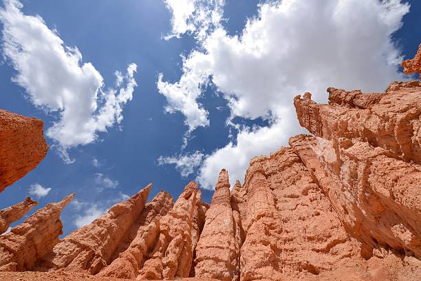 Hoodoos in the Sky Colorful hoodoos, against bright blue sky and white clouds, at Queens Garden of Bryce Canyon National Park, Utah, USA. sunrise point stock pictures, royalty-free photos & images
