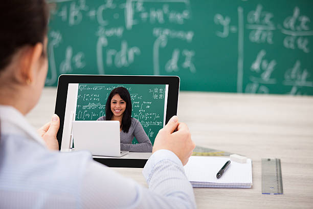 istock Woman Having Videochat With Digital Tablet 473447288
