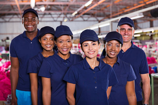 istock group of happy clothing factory workers 473447822