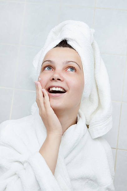 istock Happy young woman after bath 473448266