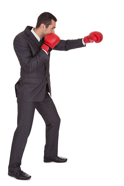 istock Competitive businessman in boxing gloves 473448798