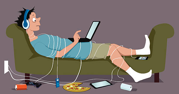 Connected Young guy, addicted to internet, lying on a couch, tangled up in cables from his many gadgets, a laptop sitting on his stomach, pizza and empty soda cans lying on the floor, vector illustration, no transparencies, EPS 8 computer addiction stock illustrations