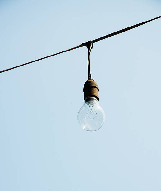 istock Turning off an electric light bulb 473455382