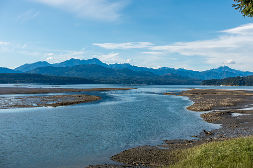 A view looking north from the south end of Hood Canal in Washington State. The Olympic Mountains can be seen in the distance.