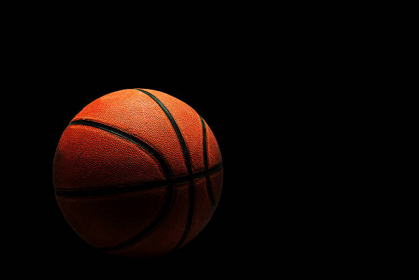 istock Old Basketball isolated on black background. 473457240