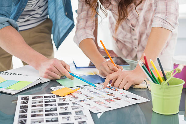 istock Teamwork brainstorming and editing photos together 473457572