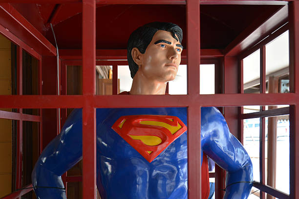 Superman model standing in a phone booth Ayutthaya,Thailand - February 07, 20153:Superman model standing in a phone booth at Thung Bua Chom floating market superman named work stock pictures, royalty-free photos & images
