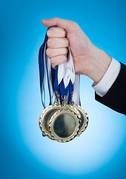 istock Businessman Holding Medals 473462054