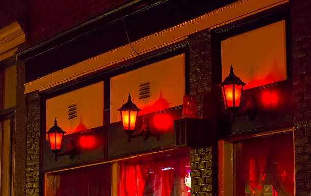 quartiere a luci rosse - prostitution night horizontal outdoors foto e immagini stock