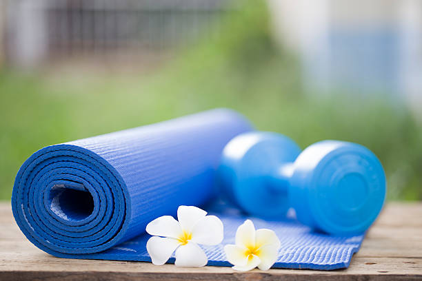 istock yoga mat and a dumbbell 473462964