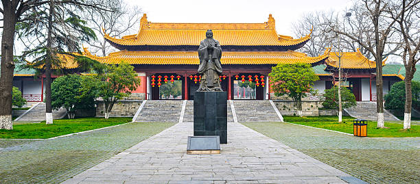 istock Confucius statue and Traditional Chinese building 473463018