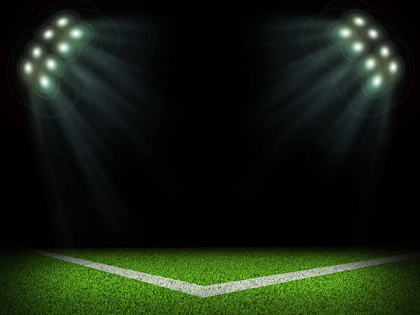 istock Corner of empty stadium with bright spotlights 473463076