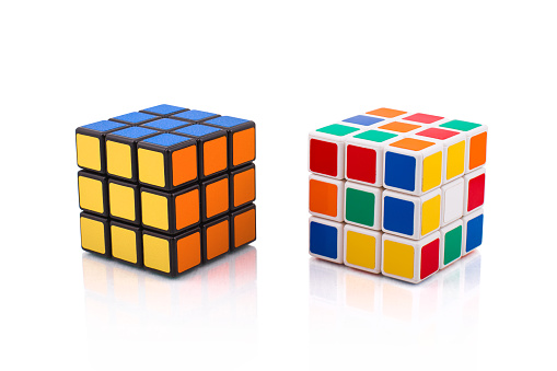 Kragujevac, Serbia - April 9, 2015: Rubik's Cubes on a white background. Rubik's Cube invented by a Hungarian architect Ernő Rubik in 1974.