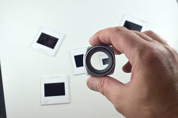 istock Inspecting Film Slides With a Loupe 473470766