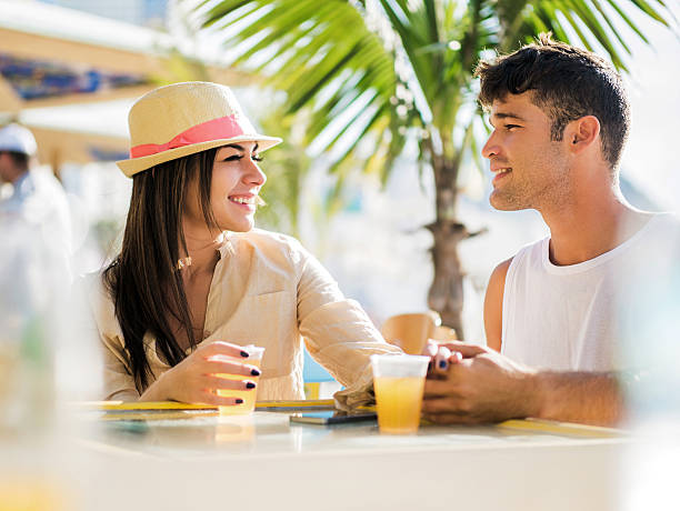 istock Young smiling Hispanic couple having a date in a cafe. 473473898