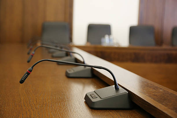istock Microphones in conference room 473482954