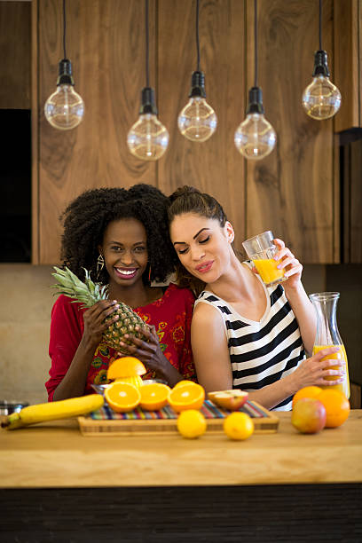 istock Women in the kitchen with fruits 473483926