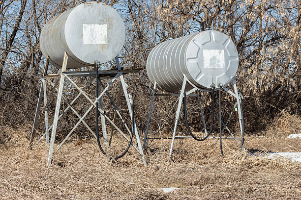 old fashioned round gas tanks sitting on tall stands