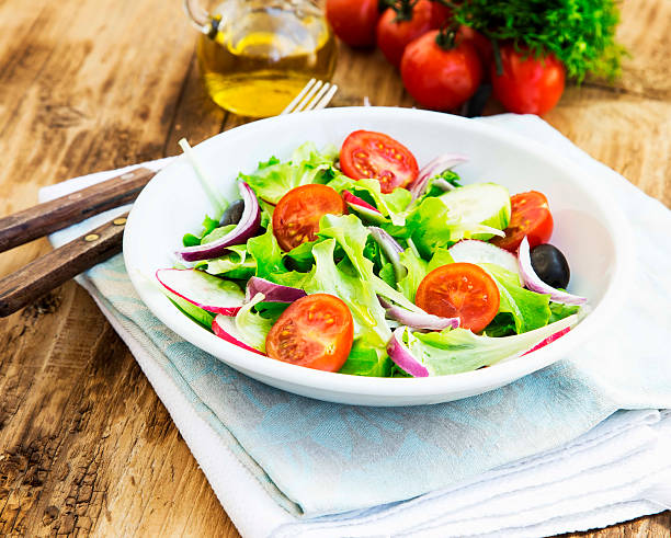 istock Vegetables Salad Dish with Fresh Organic Lettuce,Tomatoes,Olives 473503190