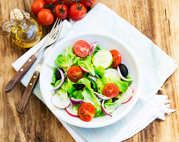 istock Vegetables Salad Dish with Fresh Organic Lettuce,Tomatoes,Olives 473503218