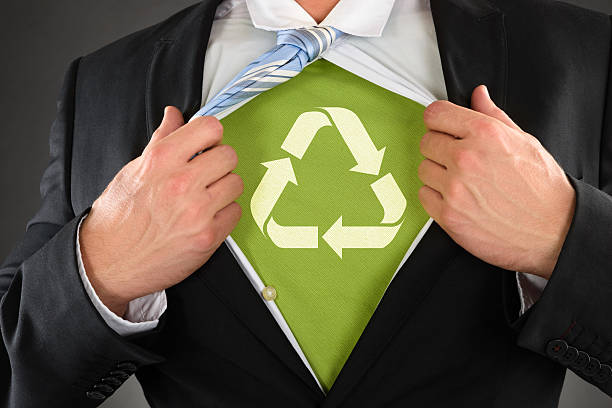 бизнесмен, показывая переработанного символ под его рубашку - recycling green environment superhero стоковые фото и изображения